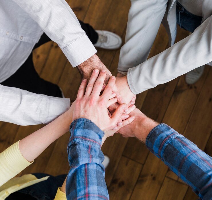 businesspeople-stacking-hands